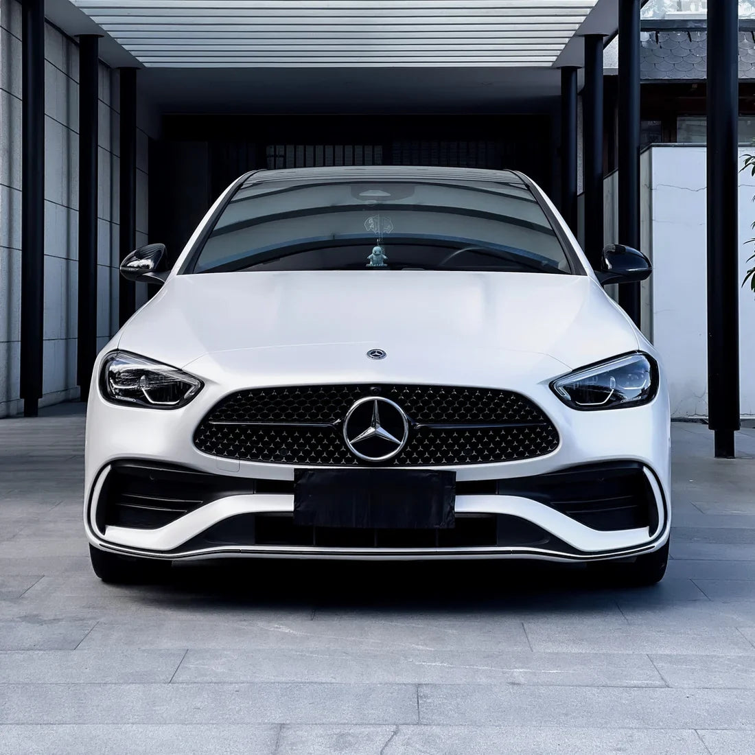 A white satin matte car wrap on Mercedes-Benz sedan