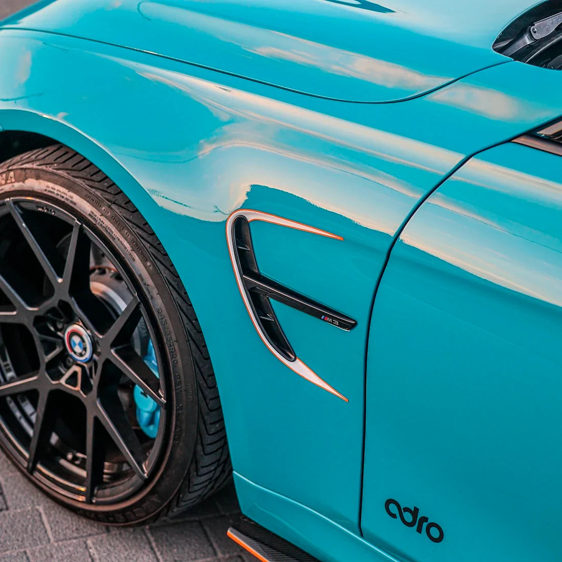 BMW fender in Rolling Sea Teal high super gloss vinyl finish.