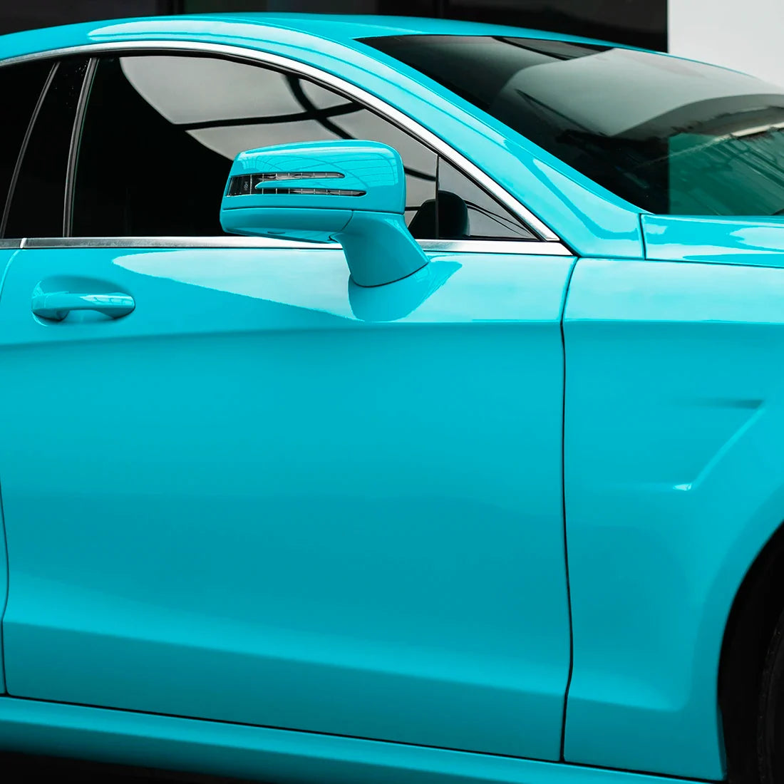 Mercedes-Benz side door in High Gloss Rolling Sea Vinyl Wrap finish.