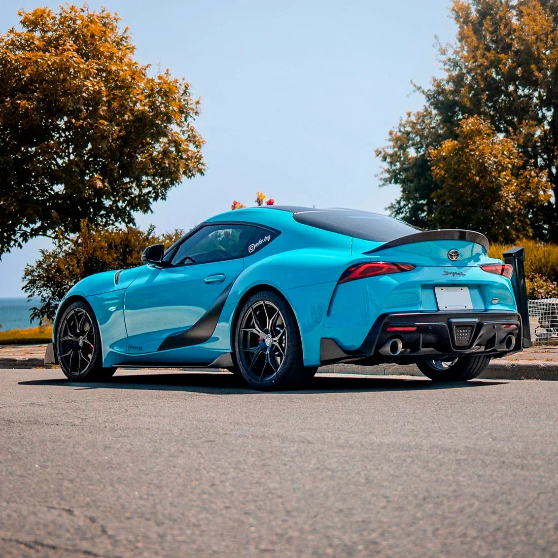 Toyota Supra rear view in High Gloss Rolling Sea Vinyl Wrap