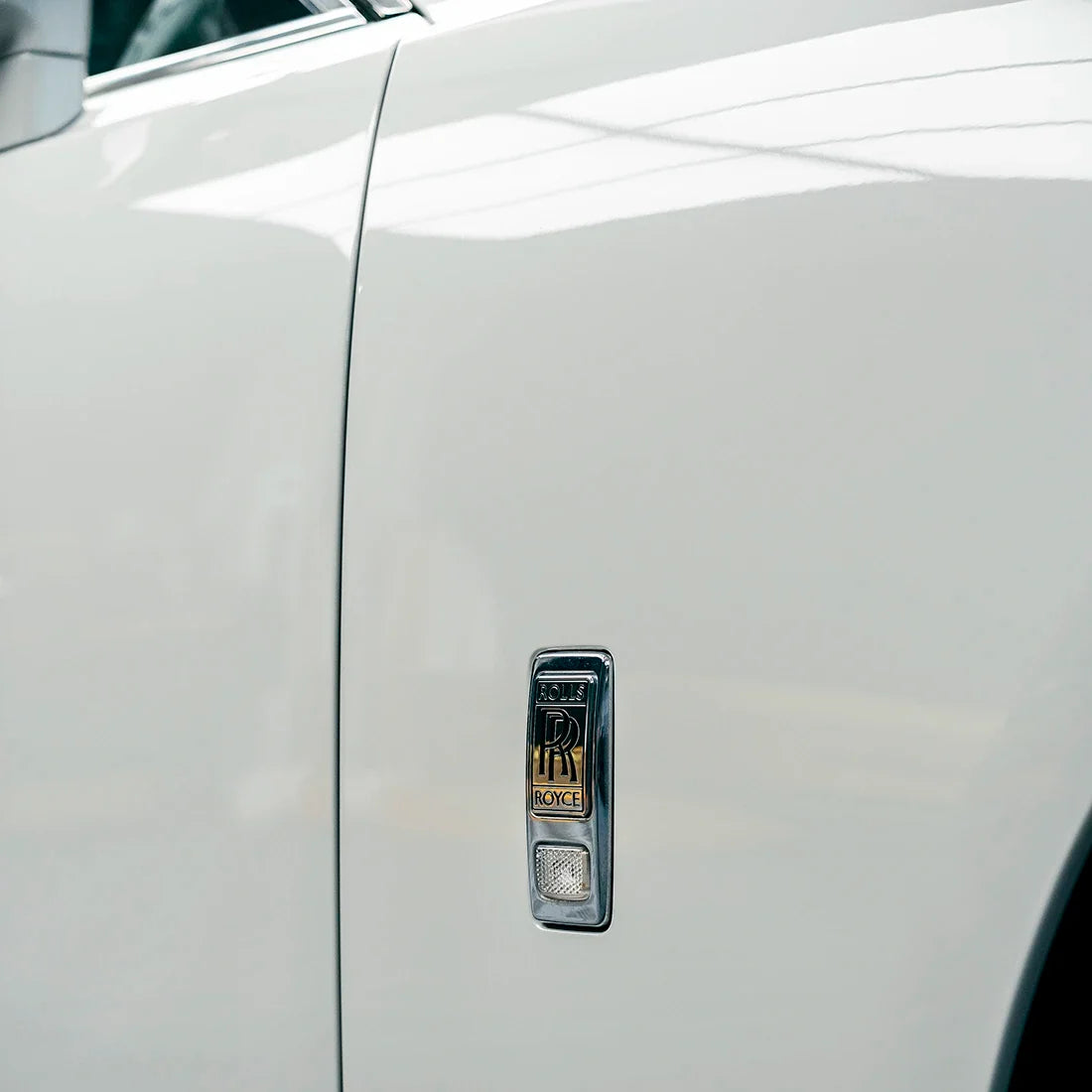 High Gloss Pale Celadon Vinyl Wrap on Rolls Royce Fender Close-Up