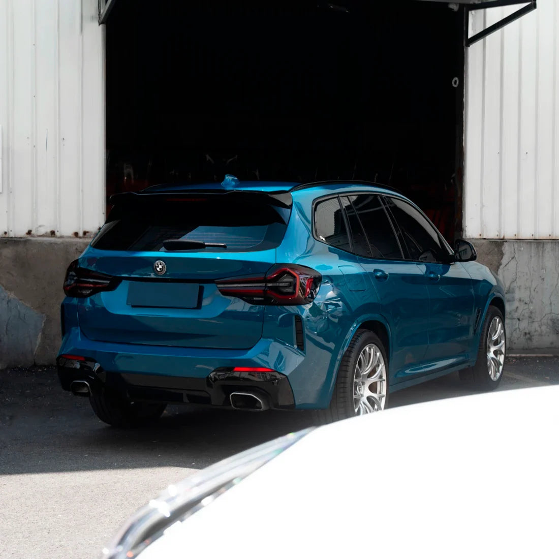 High Gloss Avalon Teal Vinyl Wrap on BMW Rear Three-Fourth View