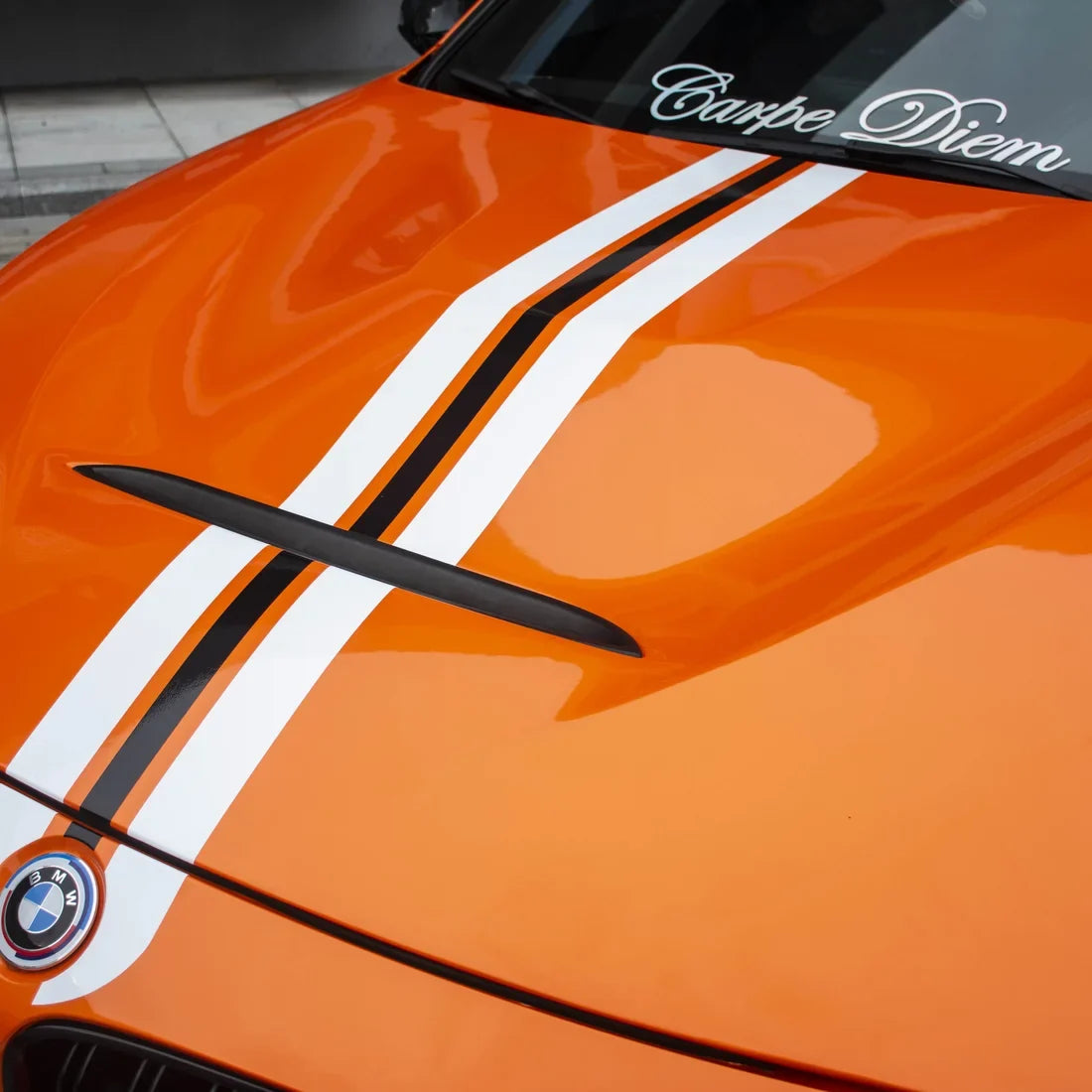High Gloss Tangerine Orange Vinyl Wrap on BMW M3 Hood Close-Up