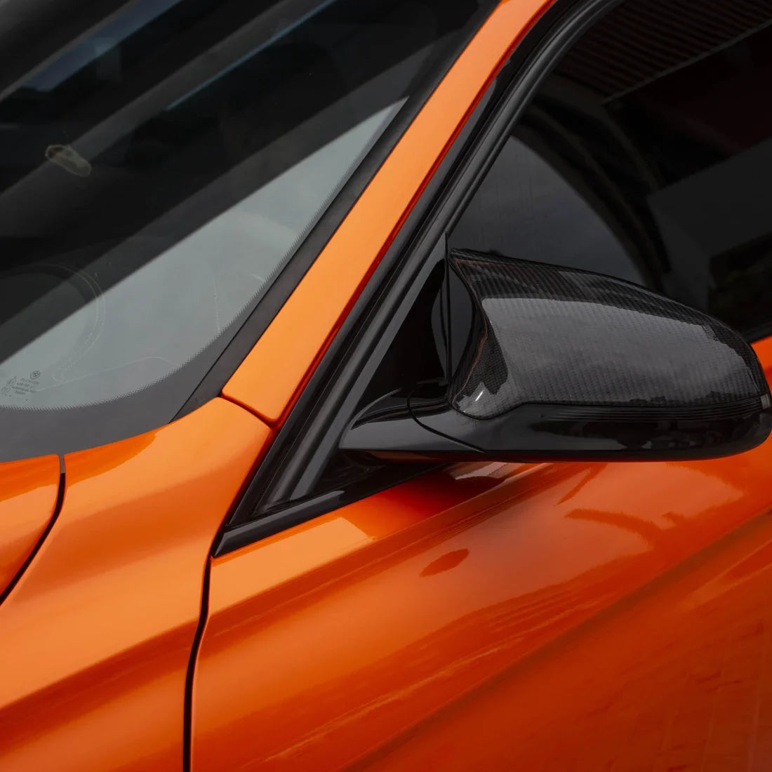 High Gloss Tangerine Orange Vinyl Wrap on BMW M3 Mirror Close-Up