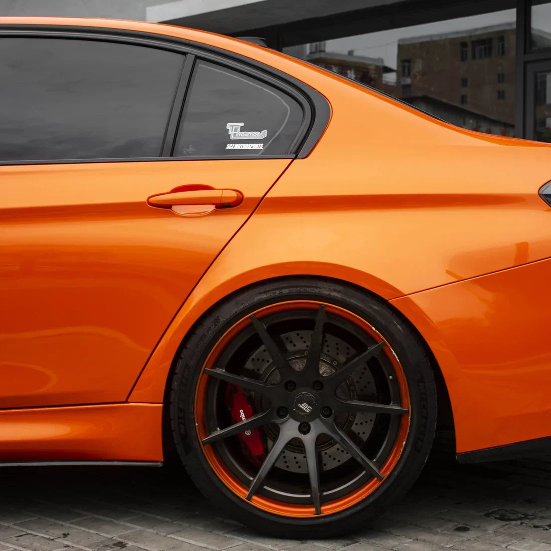 High Gloss Tangerine Orange Vinyl Wrap on BMW M3 Side View