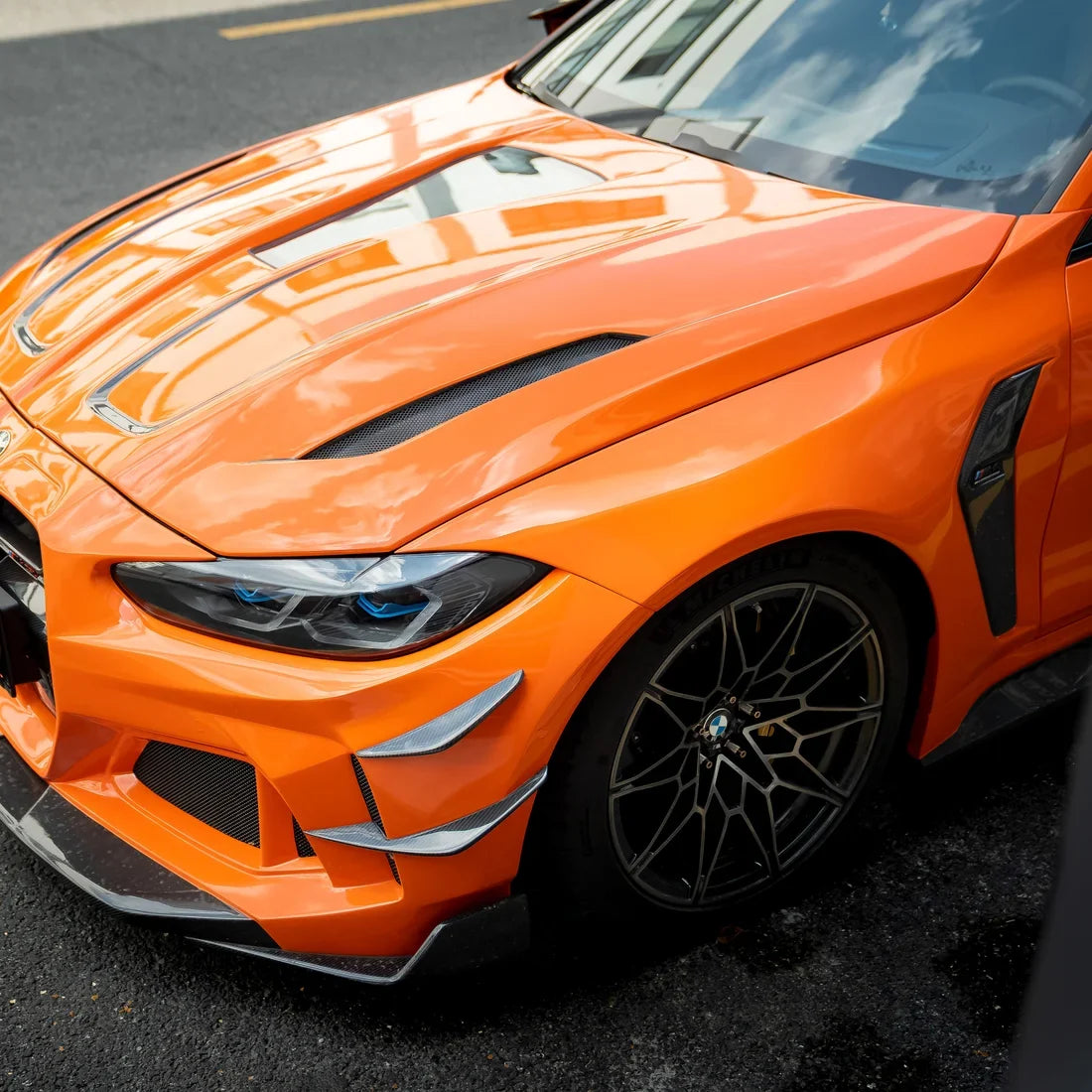 High Gloss Tangerine Orange Vinyl Wrap on BMW M4 Front Close-Up