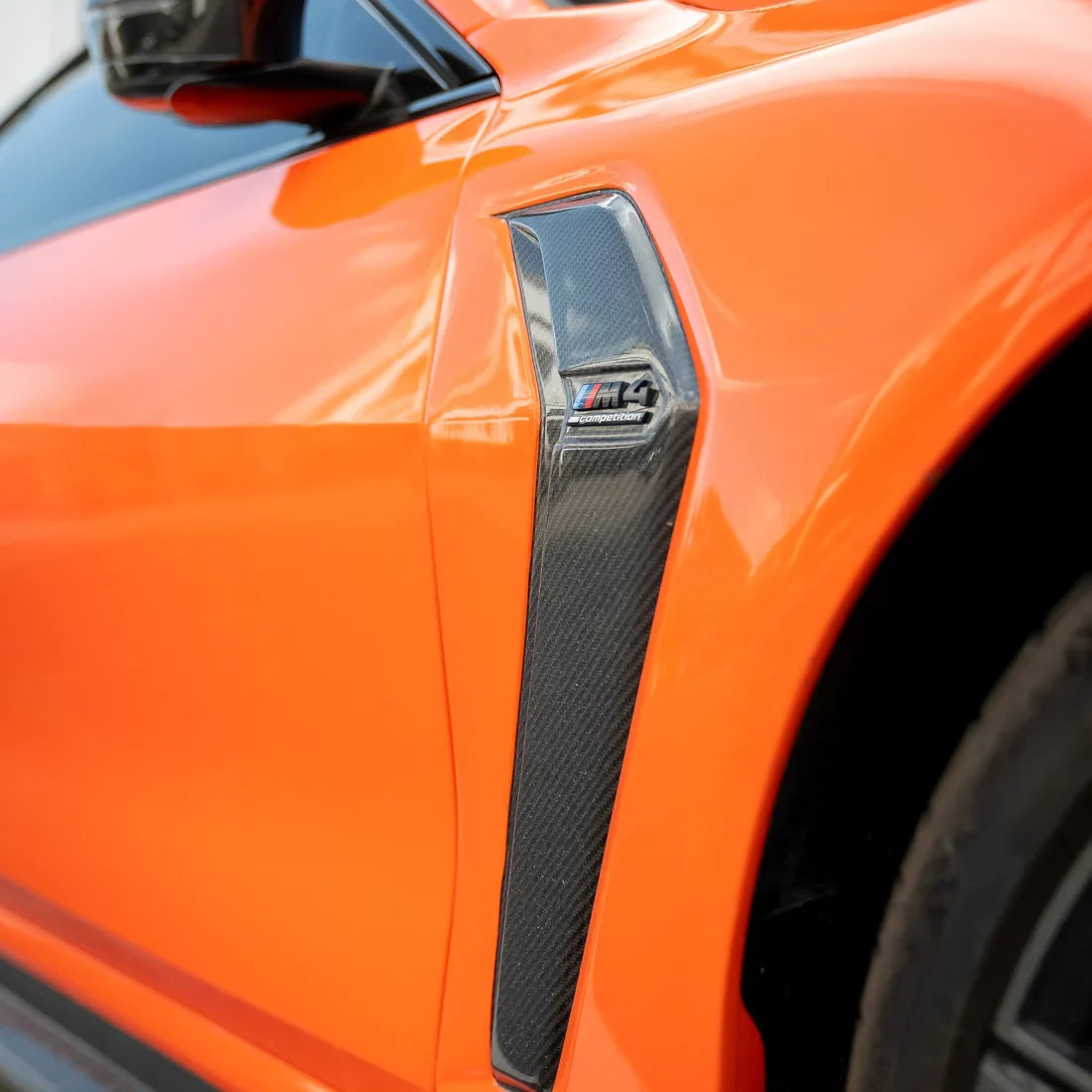 High Gloss Tangerine Orange Vinyl Wrap on BMW M4 Side Close-Up