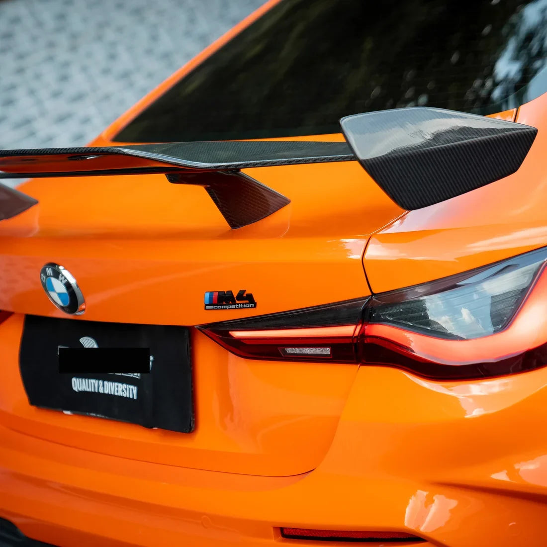 High Gloss Tangerine Orange Vinyl Wrap on BMW M4 Hood Close-Up