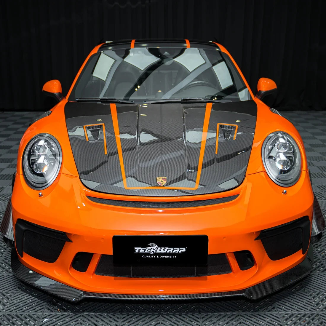 High Gloss Tangerine Orange Vinyl Wrap on Porsche Front Close-Up