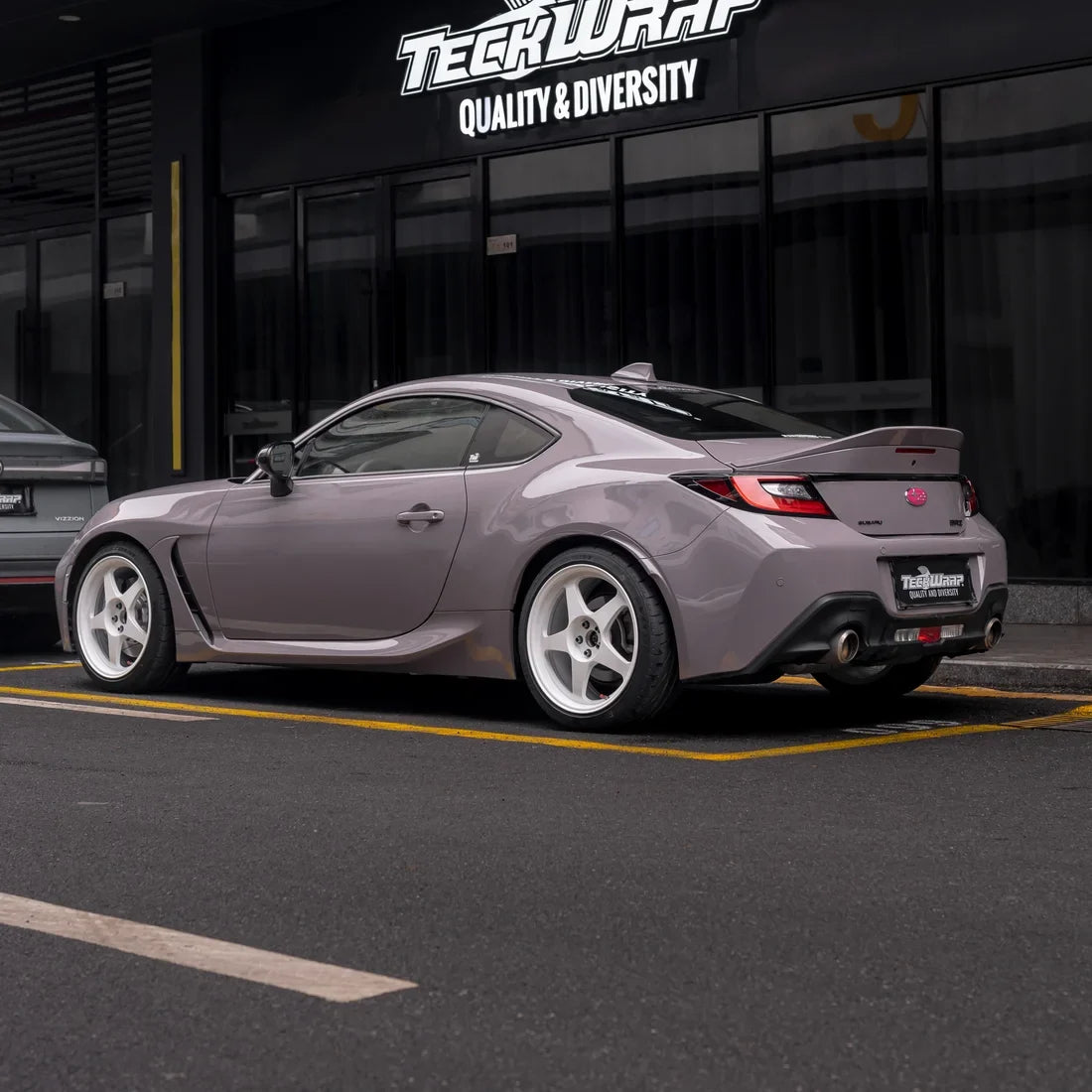 High Gloss Wild Dove Vinyl Wrap on super car in teckwrap parking