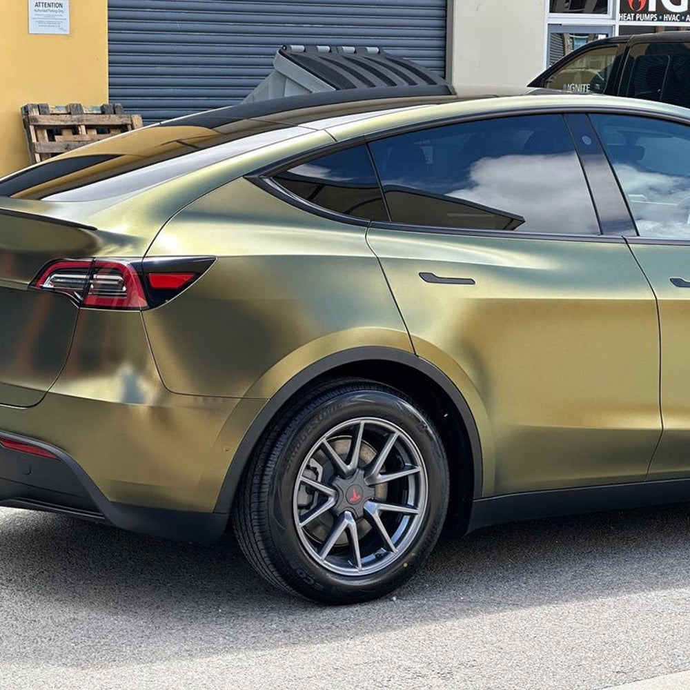 Rear-side view of Tesla Model Y Gloss Metallic Gold Black Vinyl Wrap