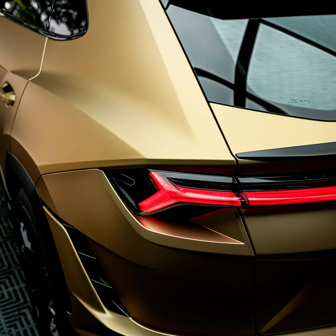 Satin Metallic Imperial Gold vinyl wrap on Lamborghini Urus taillight