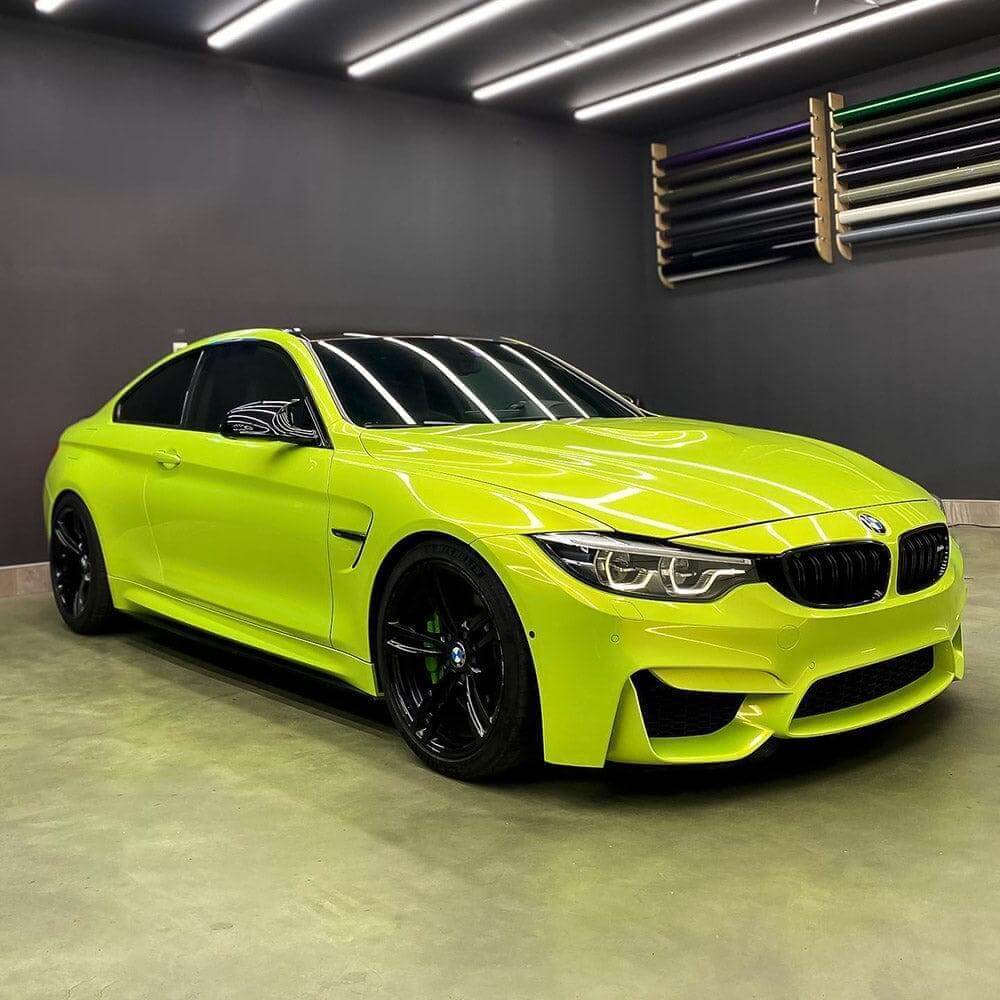 BMW coupe fully wrapped in TeckWrap Acid Lime vinyl,