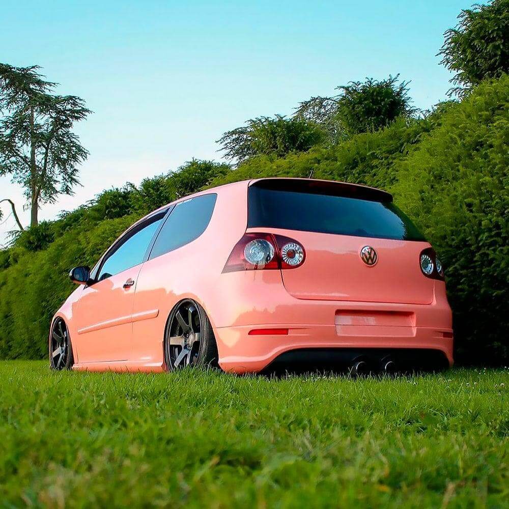 Customized Volkswagen Golf featuring TeckWrap Gloss Amber Rose vinyl wrap,