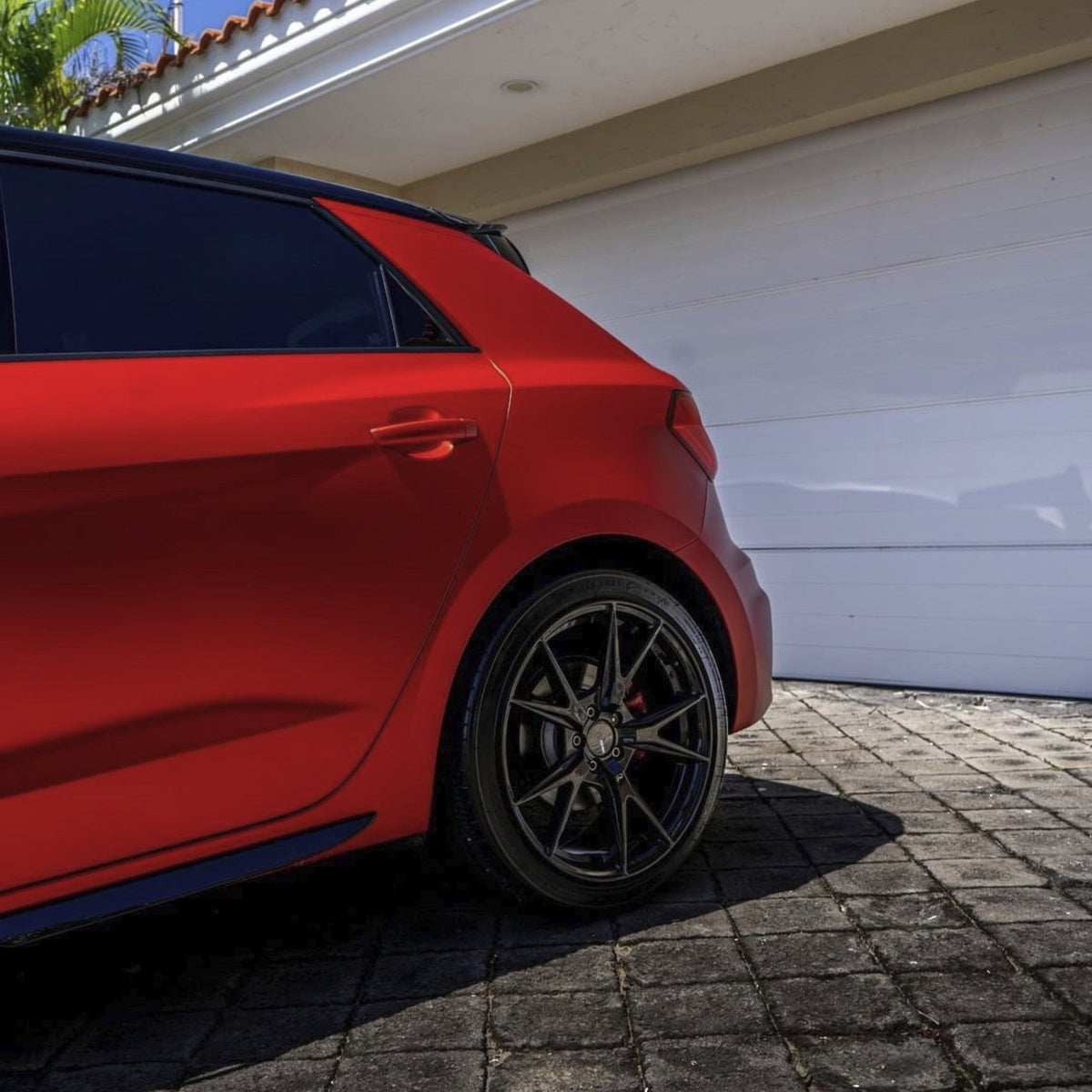 Audi hatchback featuring Flame Red satin vinyl wrap