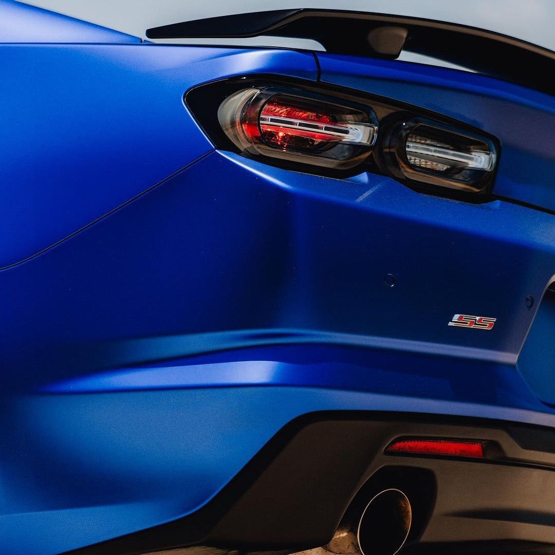 Corner of Chevrolet Camaro Satin Metallic Rasant Blue Vinyl Wrap