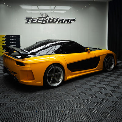 Car wrapped in High Gloss Papaya Orange Vinyl Wrap