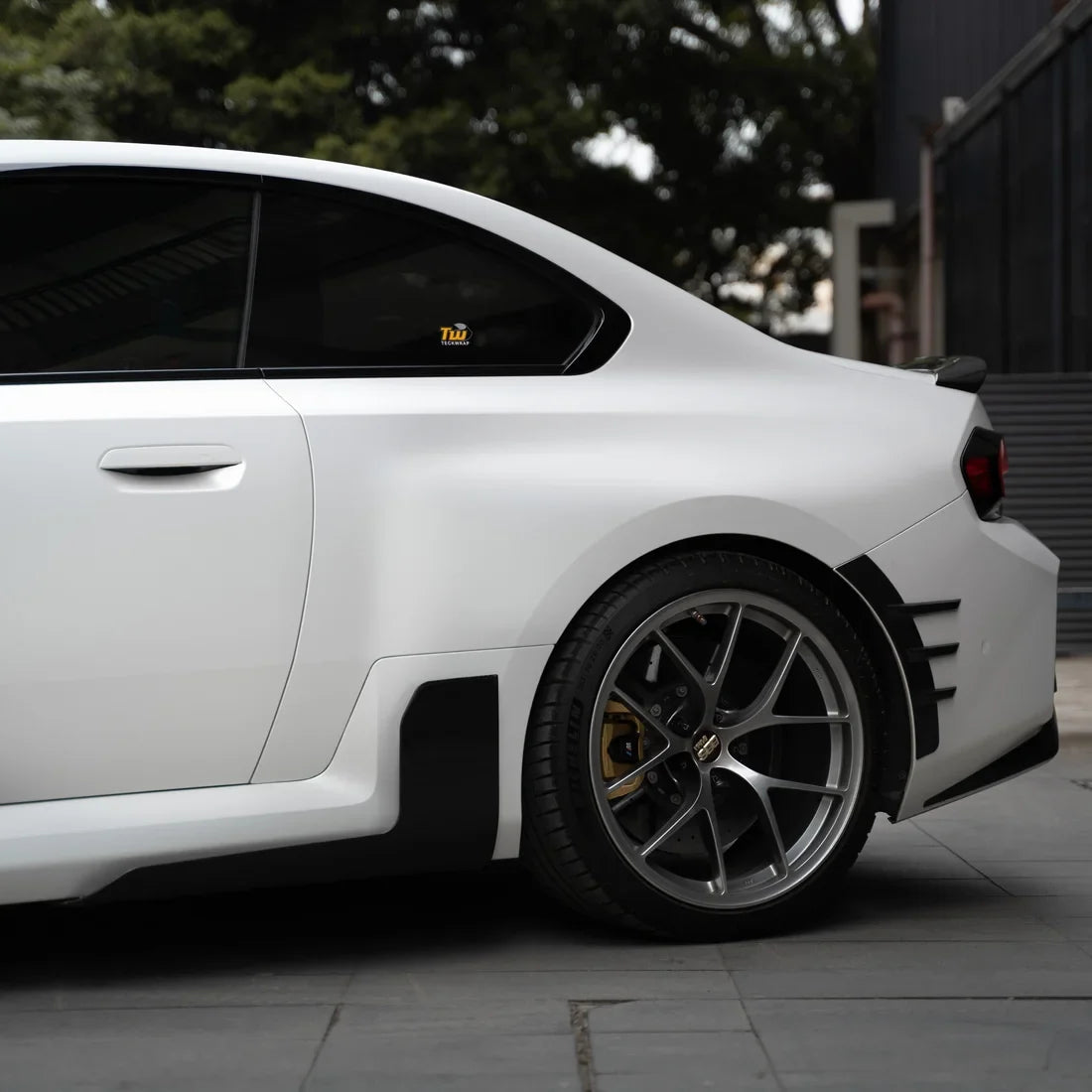 white satin matte vinyl wrap on BMW back side view