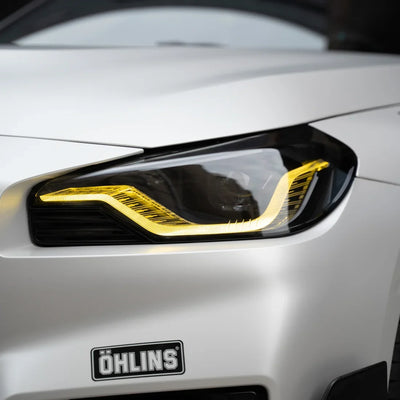 white satin matte vinyl wrap on BMW light and bumper