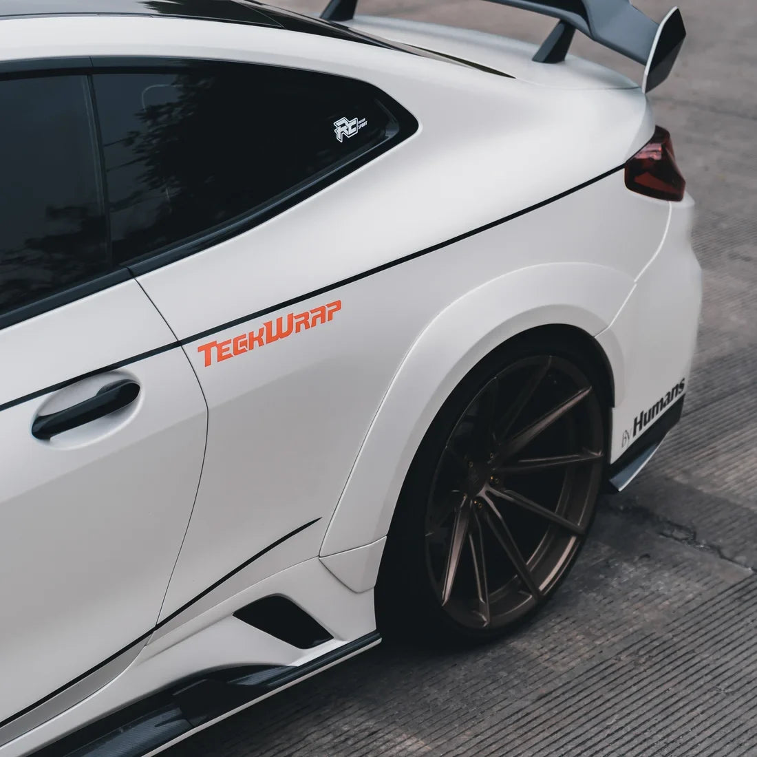 white satin matte vinyl wrap on bmw sports coupe