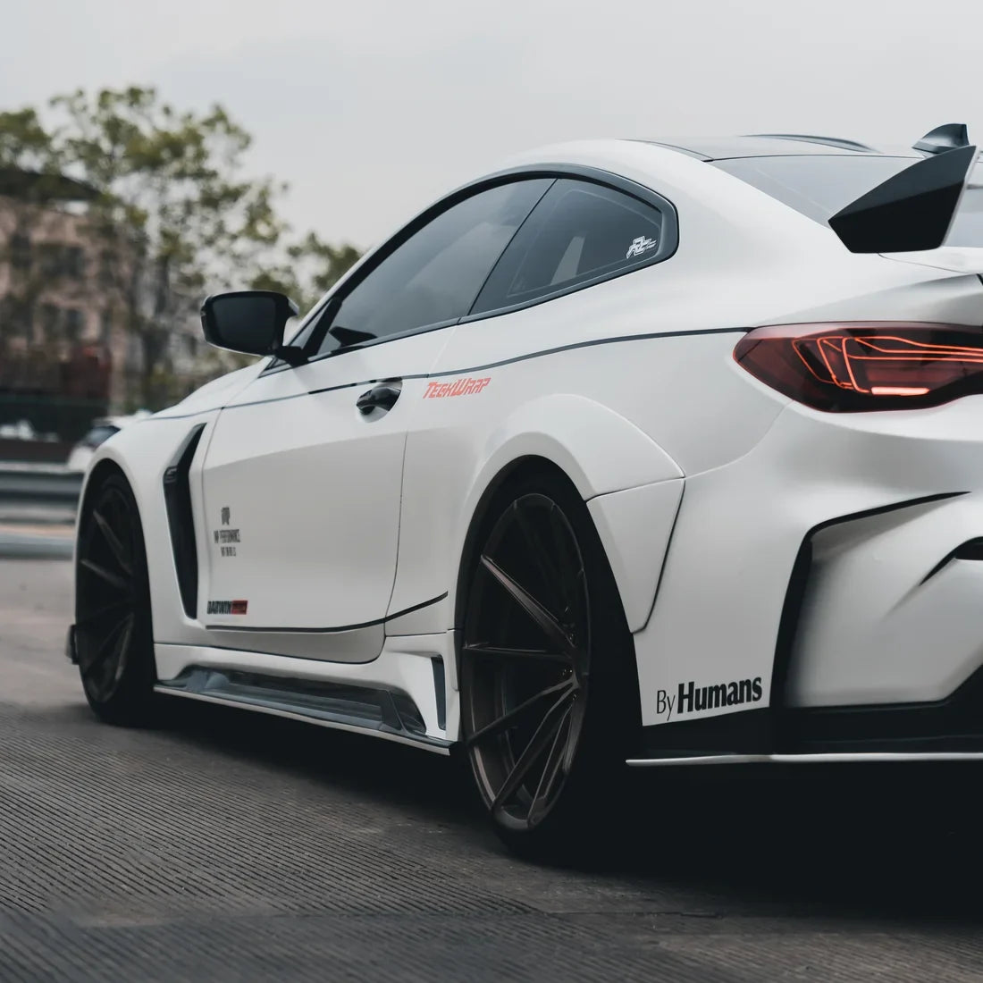 A  white satin matte vinyl wrap on BMW M2
