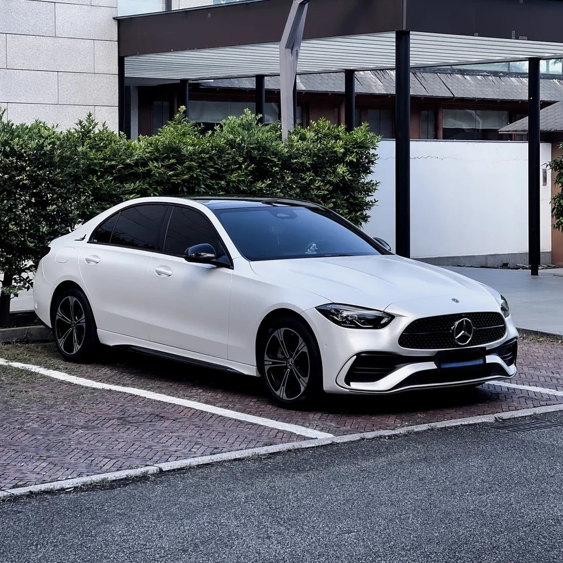 White satin matte vinyl wrap on Mercedes-Benz sedan