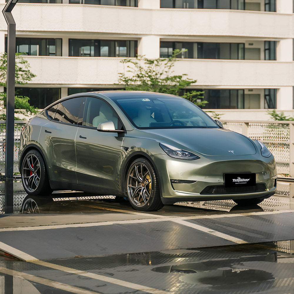 Front side view of Tesla Model Y Gloss Metallic Wilderness Green Vinyl Wrap