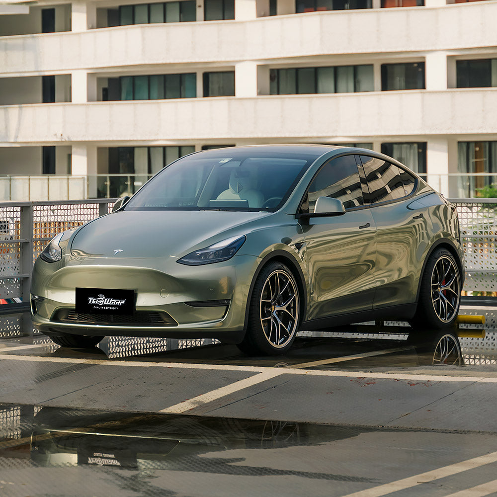 Side view of Tesla Model Y Gloss Metallic Wilderness Green Vinyl Wrap