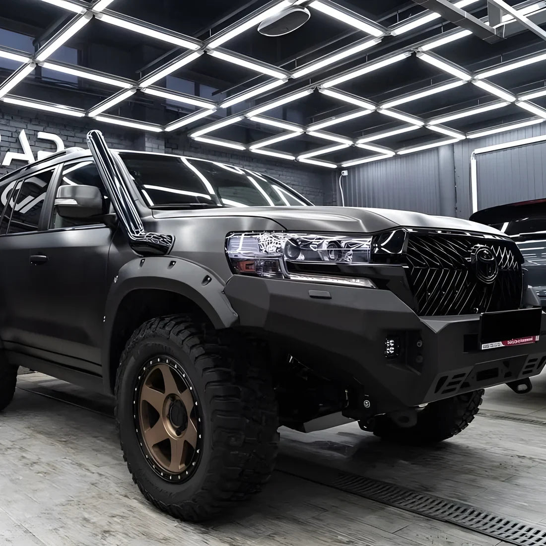 Carbon Brushed Black Vinyl Wrap across a SUV.