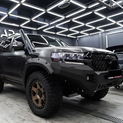 Carbon Brushed Black Vinyl Wrap across a SUV.