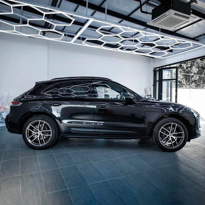 Porsche side view in Black Gloss Vinyl Wrap.