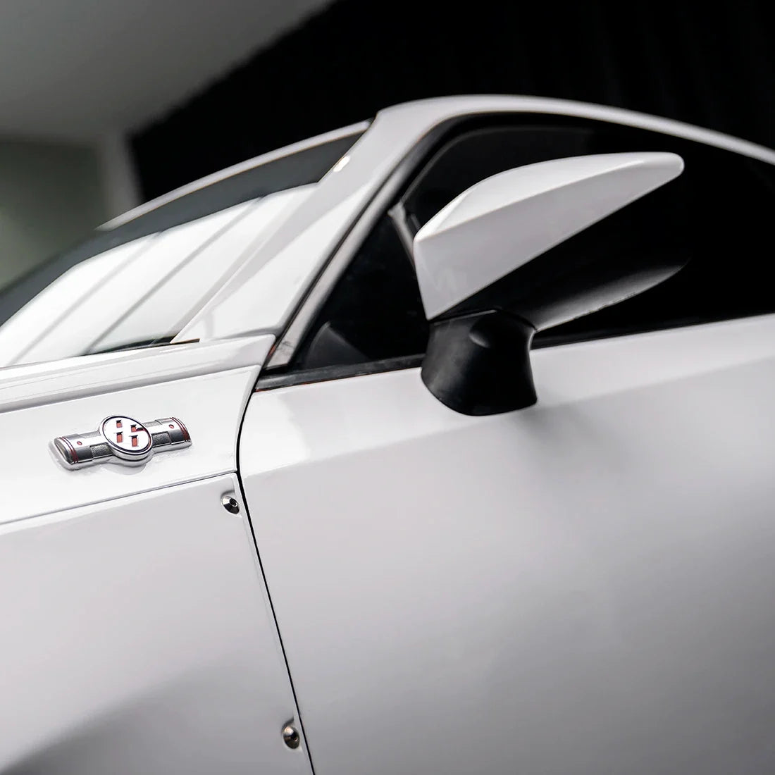 Close-up of Toyota side mirror High Gloss White Vinyl Wrap