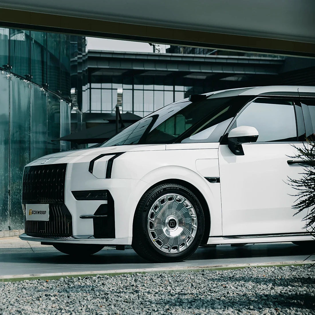 Front side view of MPV in High Gloss White Vinyl Wrap