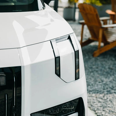 Close-up of MPV headlight area wrapped in High Gloss White Vinyl Wrap