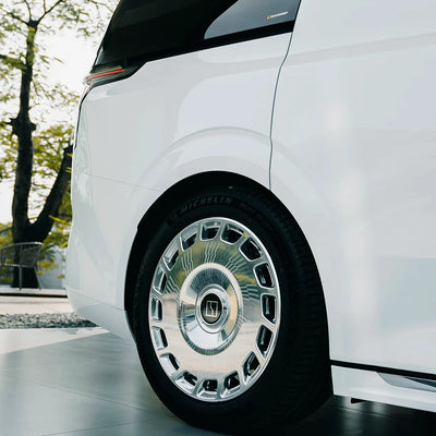 Rear wheel area of MPV wrapped in High Gloss White Vinyl Wrap