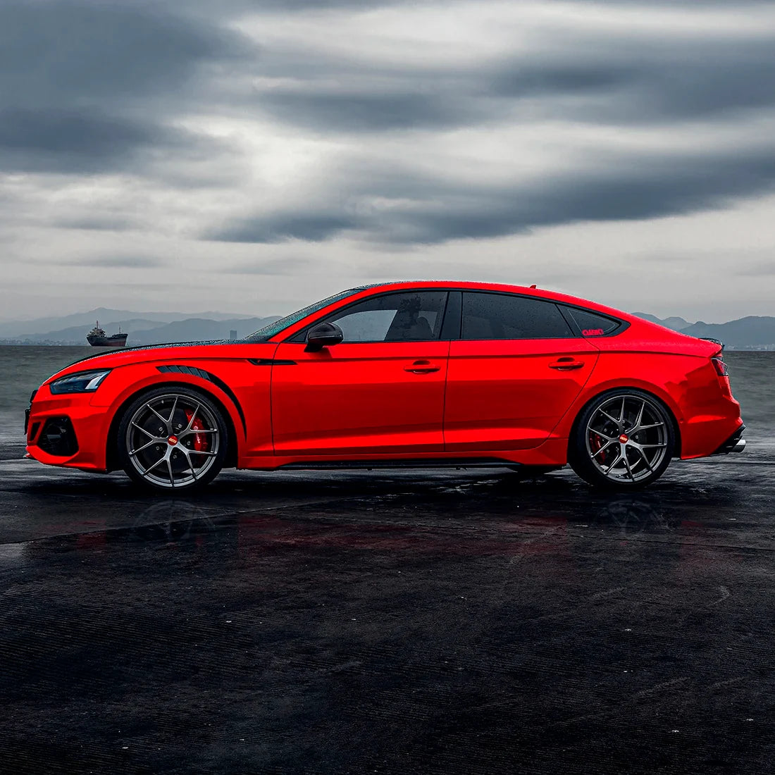 Audi side view in High Gloss Racing Red Vinyl Wrap