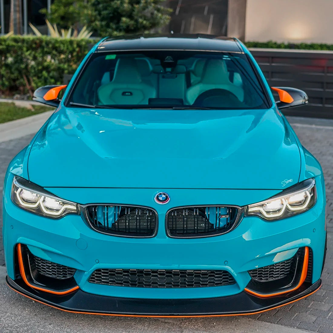 BMW hood in High Gloss Rolling Sea Vinyl Wrap