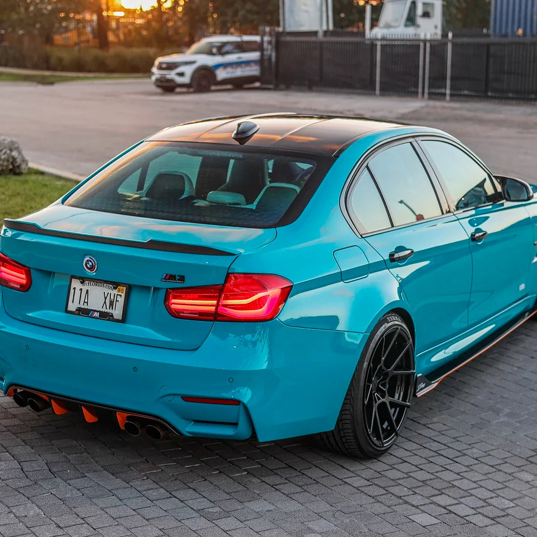 BMW rear view in High Gloss Rolling Sea Vinyl Wrap