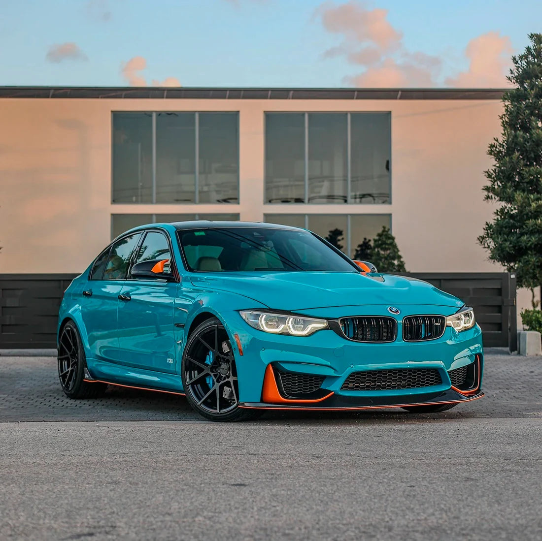 BMW car parked in High Gloss Rolling Sea Vinyl Wrap