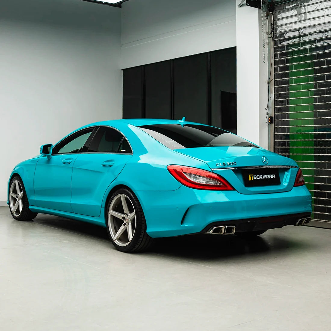 Mercedes-Benz back view in High Gloss Rolling Sea Vinyl Wrap finish.