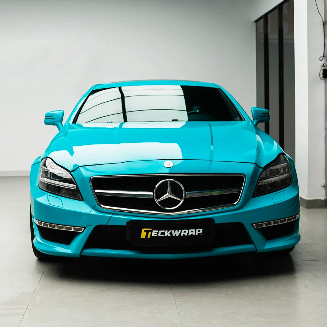 Mercedes-Benz full front in High Gloss Rolling Sea Vinyl Wrap finish.