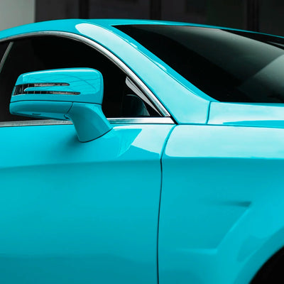 Mercedes-Benz mirror in High Gloss Rolling Sea Vinyl Wrap finish.