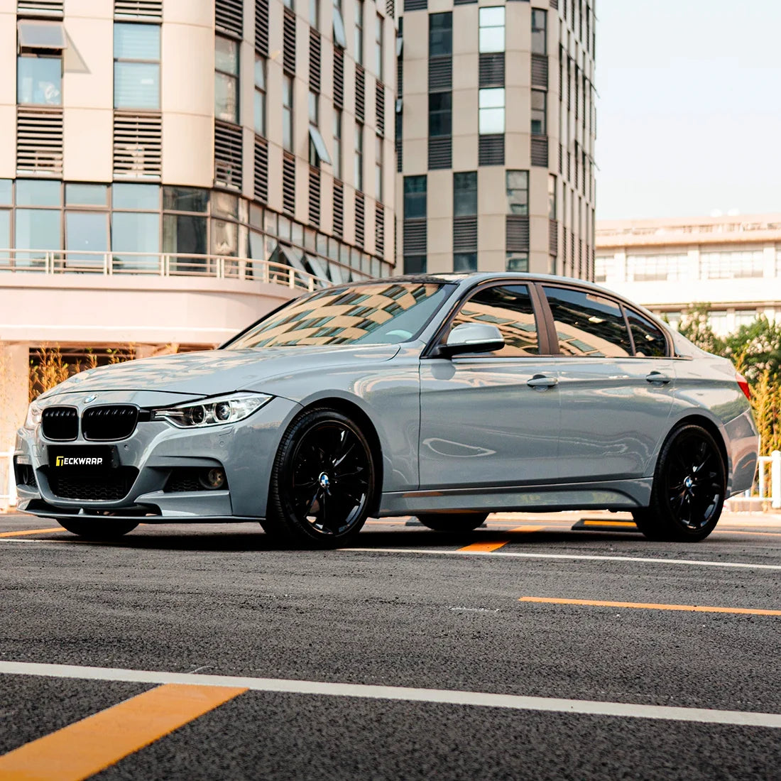 BMW sedan wrapped inHigh Gloss True Nardo Grey Vinyl Wrap