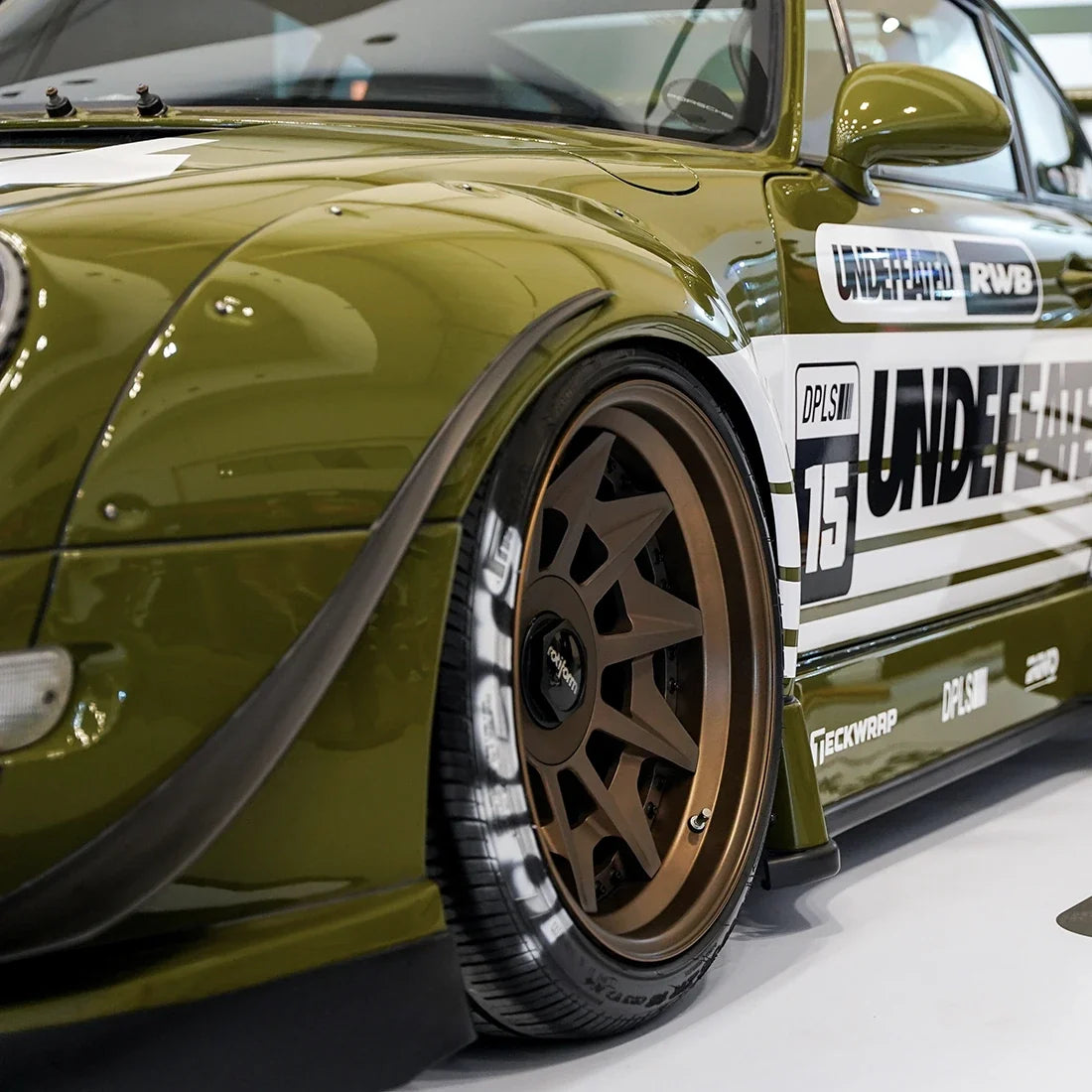 High Gloss Khaki Green Vinyl Wrap on Porsche Side View