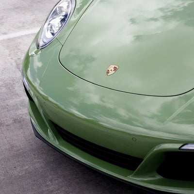 High Gloss French Olive Green Vinyl Wrap on Porsche Front Bumper Close-Up