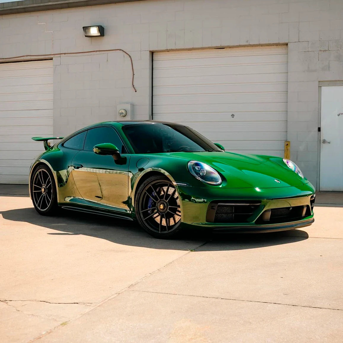 High Gloss Amphibian Green Vinyl Wrap on Porsche Side View