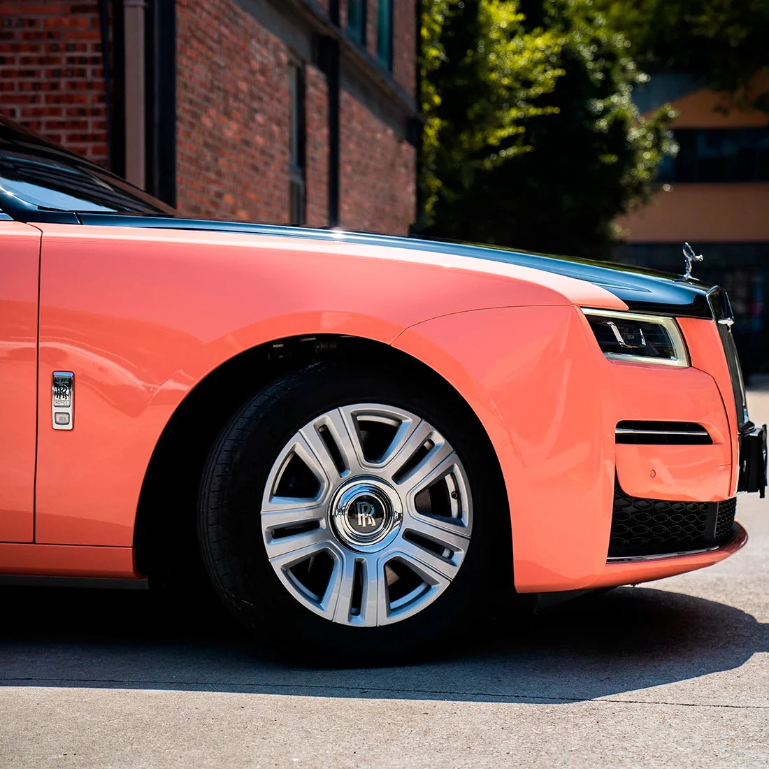 High Gloss Amber Rose Vinyl Wrap on Rolls Royce Fender Close-Up