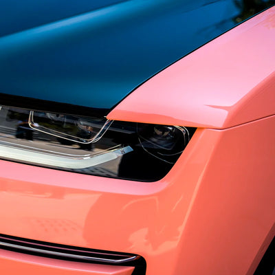 High Gloss Amber Rose Vinyl Wrap on Rolls Royce Headlight Close-Up