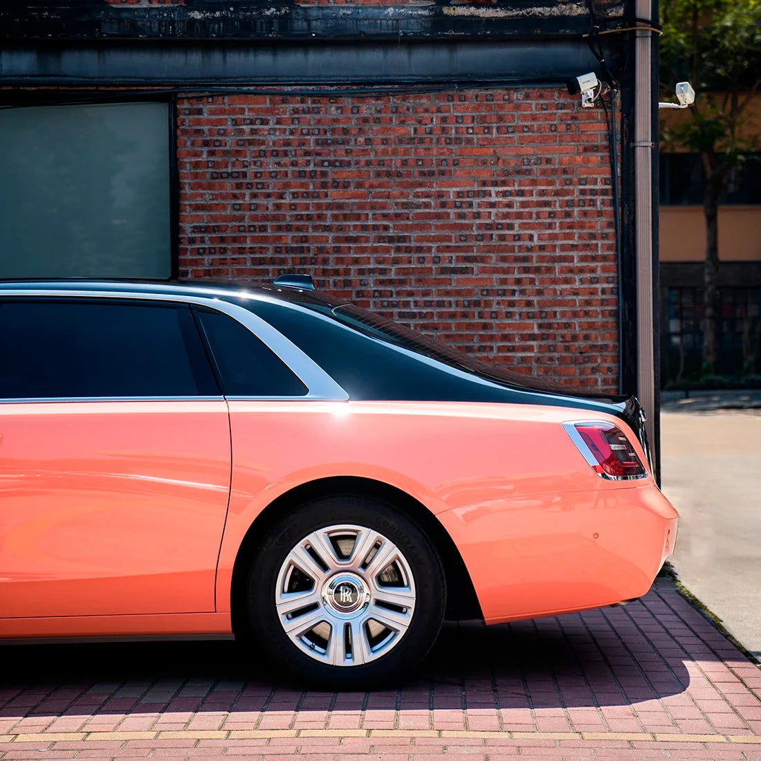 High Gloss Amber Rose Vinyl Wrap on Rolls Royce Quarter Panel View
