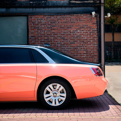 High Gloss Amber Rose Vinyl Wrap on Rolls Royce Quarter Panel View